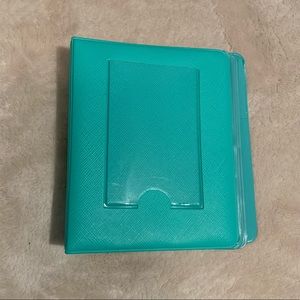 A polaroid mini photo album